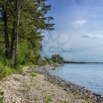 Beautiful square background to the shore of lake Udomlya may Sunny day.