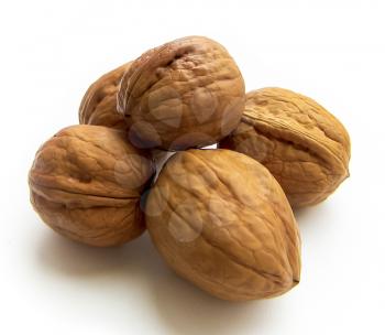 Five walnuts isolated on a white background.