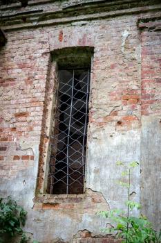 Window of the ruined temple of St. Nicholas in the village of Gribny. Russia, Tver region.
