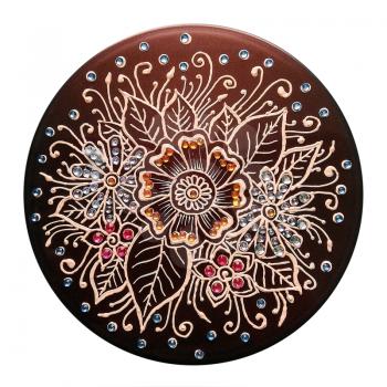 Round composition of flowers. Painting mehendi with acrylic paints. Decorated with rhinestones. Isolated on white.