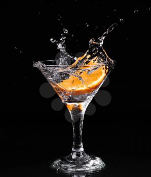 Vermouth cocktail inside martini glass over dark background