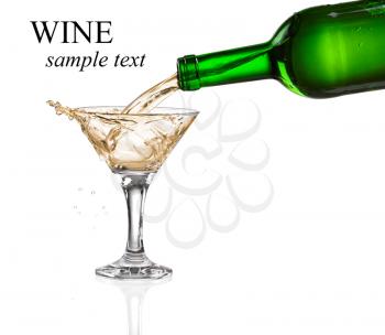 White wine pouring from the bottle intro the glass on white background (with sample text)