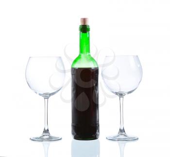 White wine bottle and two empty glasses. Isolated on white background