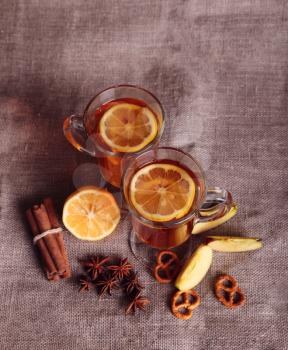 two glasses of mulled wine on the old wooden table in winter frosty day