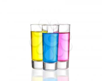 Shots - Three colourful shot drinks on a white background with reflections