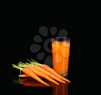 Carrots and juice in a glass