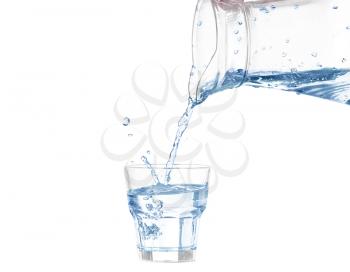 Pouring water from glass pitcher on white background
