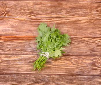 herbs hanging over wooden background