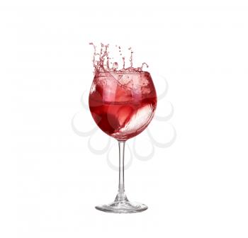 red wine pouring into wine glass isolated on a white background