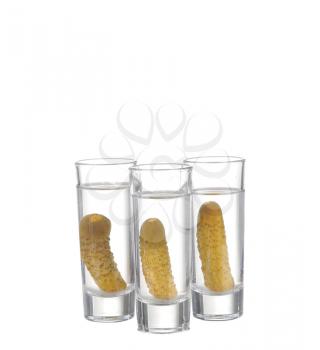 Glass of vodka and cucumber isolated on white