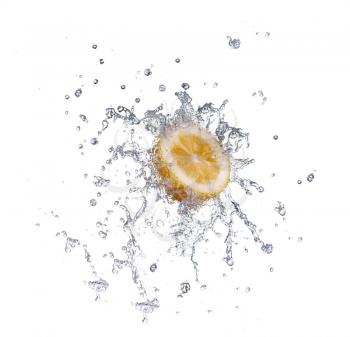 segment of lemon falling in to the water and making splash