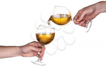 Hand wine splash in glass isolated on white