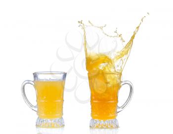 orange juice splash in glass isolated on white