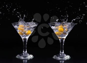 Set of Vermouth cocktail inside martini glass over dark background