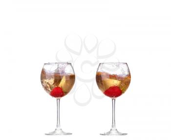 collage Single Strawberry splashing into a glass of wine