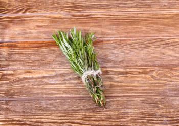 Rosemary bound on a wooden board