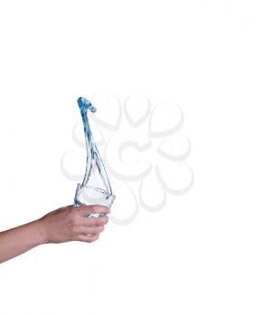 Blue water splashing in glass held by hand, white background