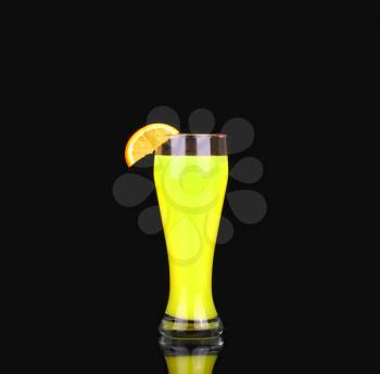 Yellow alcoholic cocktail with a slice of orange on a black background