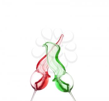 collage of red and green cocktail splashing from glass isolated on white background
