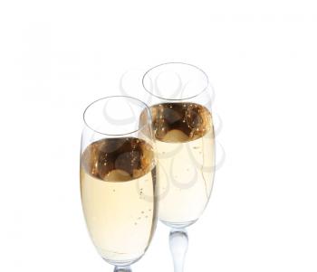 Two champagne glasses and gift on white background
