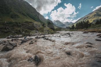 Mountain river Baksan, ravine Adyr-Su, Elbrus area, Greater Caucasus Range. Elbrus, mountains in summer. Greater Caucasus Mountains from Mount Elbrus