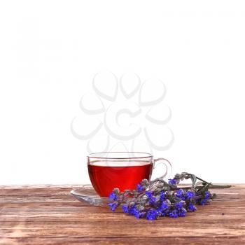 Cup of tea with blue cornflowers bouquet