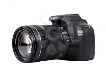 KIEV, UKRAINE, APRIL 25, 2016:  Canon EOS 1200D Kit 18-135 IS DSLR black. Canon is the world largest SLR camera manufacturer.