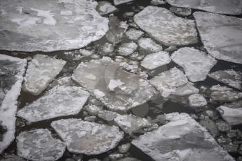 Cracked ice on river, top view