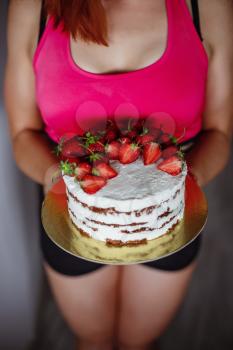 Healthy Diet And Nutrition. Portrait of happy beautiful young woman eating natural cake at home and looking at camera.Weight Loss Food Concept. I baked with for you with love.