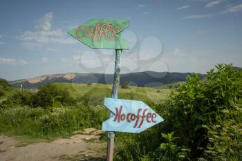 Funny signpost on a mountain road near a small cafe, Georgia, Kakheti