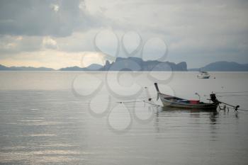 Traditional thai boats at sea. Krabi province. Low tide and silence