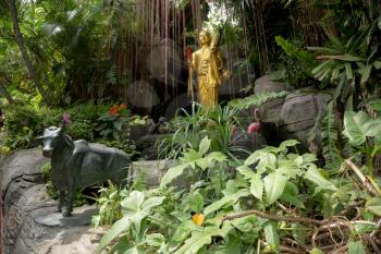 Golden Mountain temple entrance scenery. Taken in Bangkok, Thailand. Statue between fog and the garden