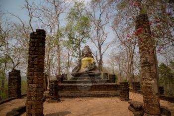 Si Satchanalai Historical Park Is the historical park of Thailand Built in the Sukhothai period Received cultural heritage registration From UNESCO. sitting buddha statue decorated with cloth
