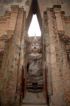 Seated Buddha image at Wat Si Chum temple in Sukhothai Historical Park, a UNESCO world heritage site in Thailand