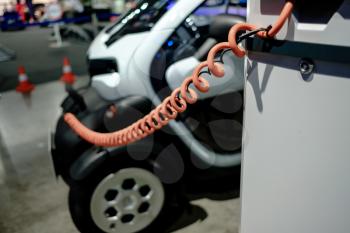 MOSCOW, SEPTEMBER 31, 2018: The newest Renault Twizy electro car on automotive exhibition stand on MMAC 2018. Automobile show of family personal cars.