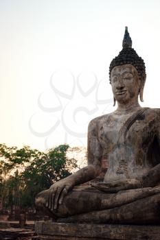 Sukhothai Historical Park, a UNESCO World Heritage Site in Thailand. Ancient Buddha Statue at Mahathat Temple.