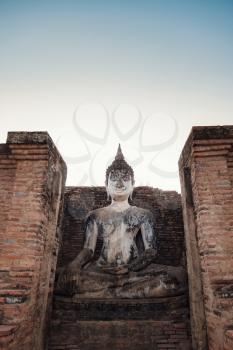 Sukhothai Historical Park, a UNESCO World Heritage Site in Thailand. Ancient Buddha Statue at Mahathat Temple.
