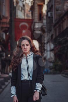 Beautiful stylish young latin woman walking the atmospheric streets of Istanbul, Turkey. The idea and concept of an interesting vacation, adventure in an amazing city