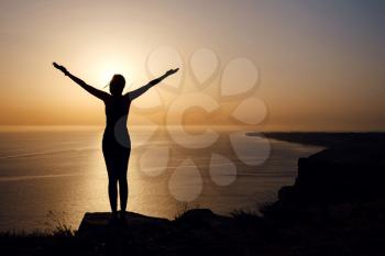 strong confidence woman open arms under the sunrise at seaside. healthy lifestyle background
