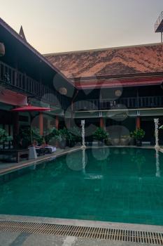 Sukhothai, a beautiful authentic hotel with a pool in the center - day and night, mobile photo