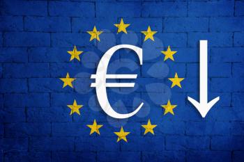 symbolic depreciation of the national currency Euro against of the country flag of European Union. Concept of depreciation of the currency, the fall of the economy and the breakdown of economic ties