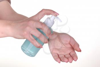 female hand holding bottle with liquid soap isolated on white background. blue alcohol cleaning gel bottle, Prevention of diseases. Covid-19. Cleaning healthy and personal hygiene.