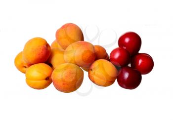 Fresh apricots and plums isolated on the white background. concept of fresh fruits and organic products