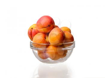 glass bowl with apricots on a white background. idea and concept of healthy and proper nutrition, organic products