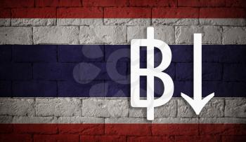 symbolic depreciation of the national currency Baht against of the country flag of Thailand. Concept of depreciation of currency, economy fall and the breakdown of economic ties