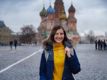Asian tourist in travel vacations in winter Moscow. woman posing in cold Red Square in central Moscow,
