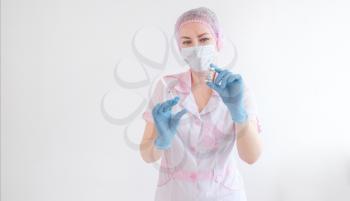 Doctor or nurse hand in blue gloves holding covid-19 vaccine disease preparing for child, baby, adult, man and woman vaccination shot, medicine and drug concept.