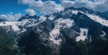 photo of mountains with snow in summer in dombai. North Caucasus, Russia.