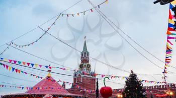 Celebration of the New Year and Christmas on the Red Square in the center of Moscow. Holiday fair and amusement park near the Kremlin.