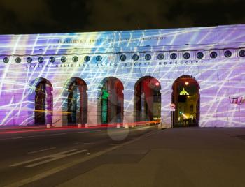 Illumination and light show on the ancient outer castle gate and arches in Heldenplatz, Vienna, Austria